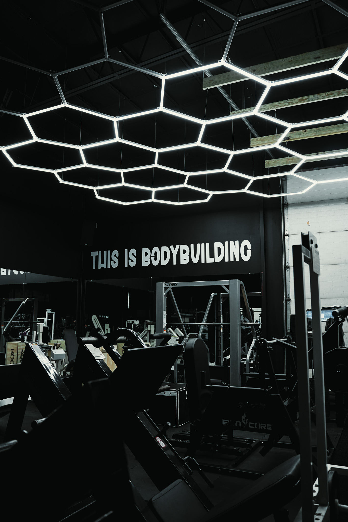This Is Bodybuilding wall sign with hexagonal ceiling lights